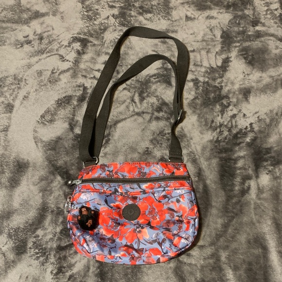 Kipling Handbags - KIPLING- Floral Crossbody Bag - Red/Blue/Black with the Iconic Monkey Keychain.